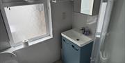 Toilet, wash basin and shower