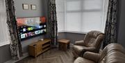 Lounge with seating and television
