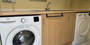 Utility with washing machine and tumble dryer