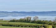 a view over Lough Foyle from the countryside, with the hills of Donegal in the background