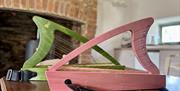 small irish harps sit on a table top inside a converted barn
