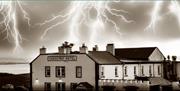 edited image of the Causeway Hotel with lightning forks in the sky above