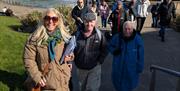 Discover Portrush Walking Tours on steps by the Arcadia