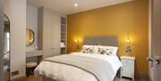 The Wishing Chair bedroom with a yellow feature wall with double bed and upholstered headboard, centred between 2 bedside lockers, built-in furniture