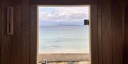Views from the sauna door, from the inside of the sauna, looking out to the sea.