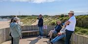 5 people with Tour Guide at Ballycastle beach