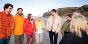 Group on the beach enjoying the Mussenden Unwind experience