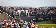 Crowds watching and enjoying The Open