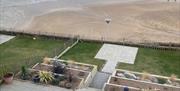 view of the beach from above the patio