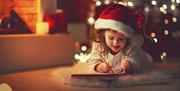 Small child writing a letter to santa