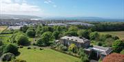 View of Cromore Estate and Cromore House with Cromore Retreat within wooded area