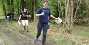 a group of people orienteering in the forest