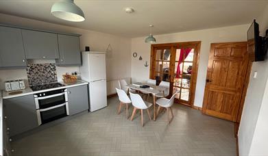interior of kitchen and dining area at Primrose Seaside Escape