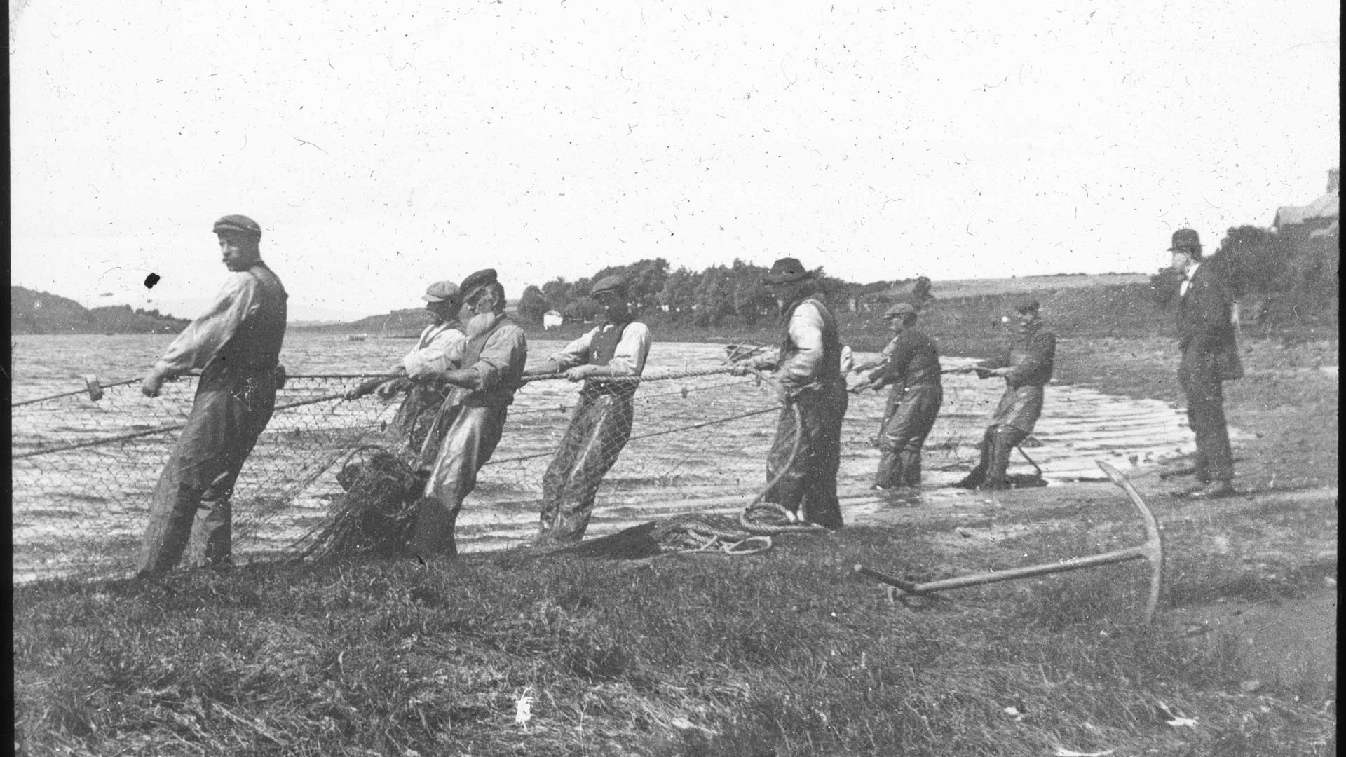 an old photograph of fishermen