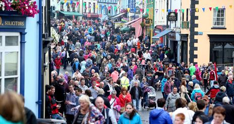 Crowds of people on a busy street in Ballycastle