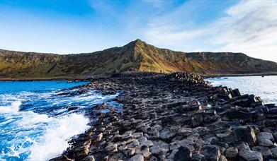 The basalt stones at the giants causeway stretch into the sea
