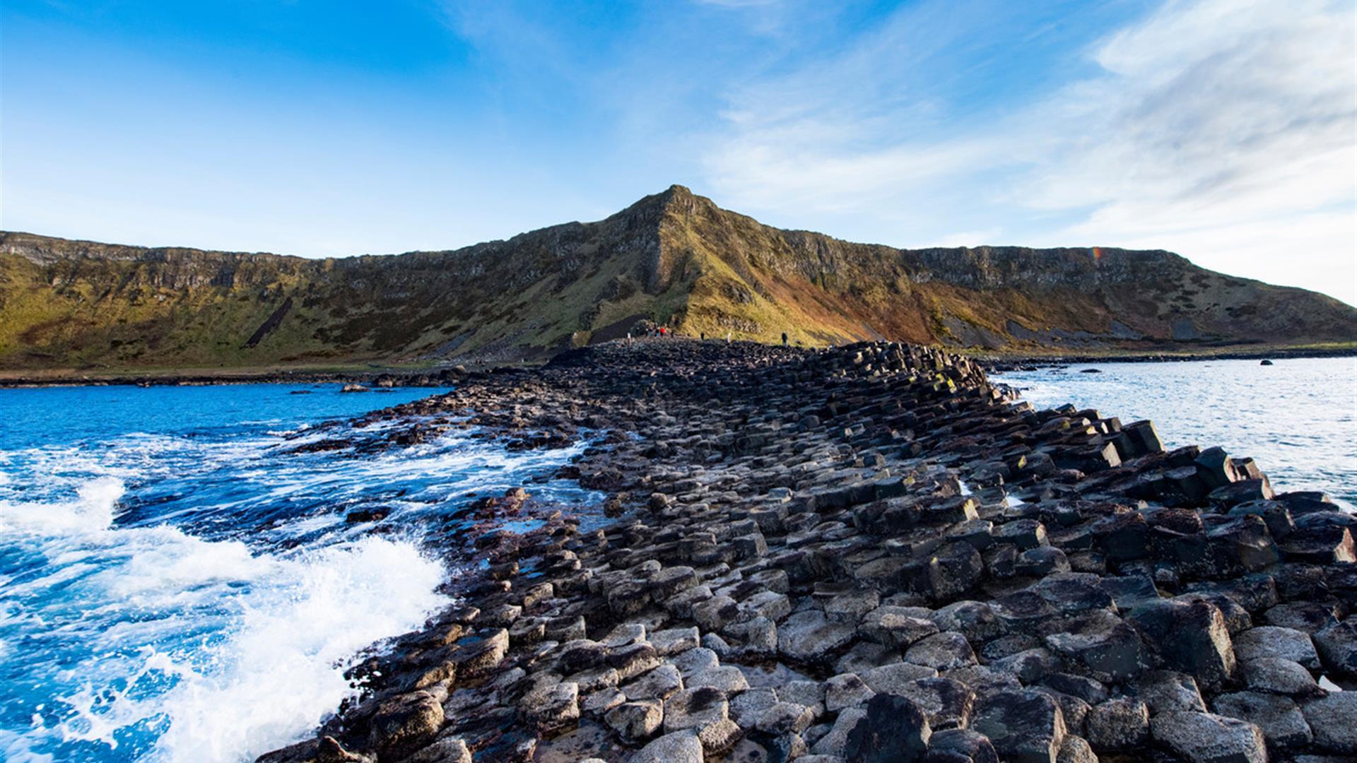 The basalt stones at the giants causeway stretch into the sea