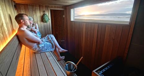 Couple enjoying a sauna