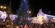 The Christmas Tree lights up the Diamond in Ballycastle as the crowds enjoy the festive entertainment