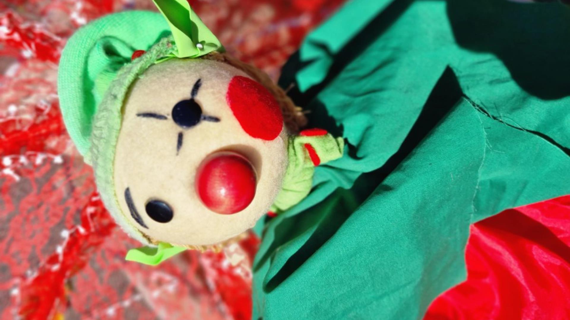 Christmas Elf puppet with a green hat, rosy cheeks and a red nose