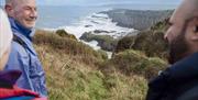Group enjoys their guided tour of the cliffs above the giants causeway Group enjoys their guided tour of the cliffs above the giants causeway