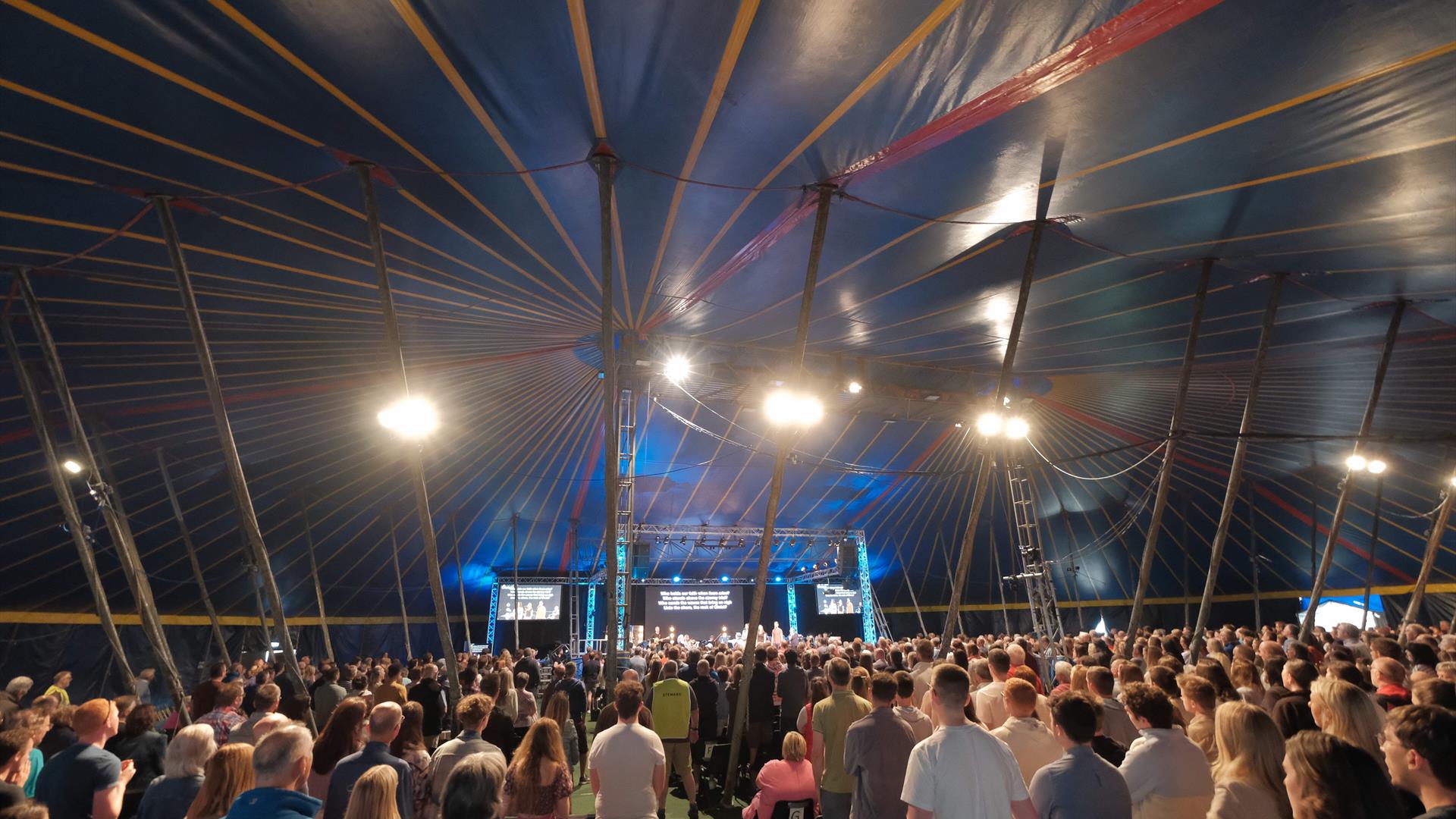 People attending New Horizon in the big blue tent