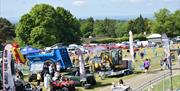 various tractors and agricultural machinery on display outdoors at the Ballymoney Show