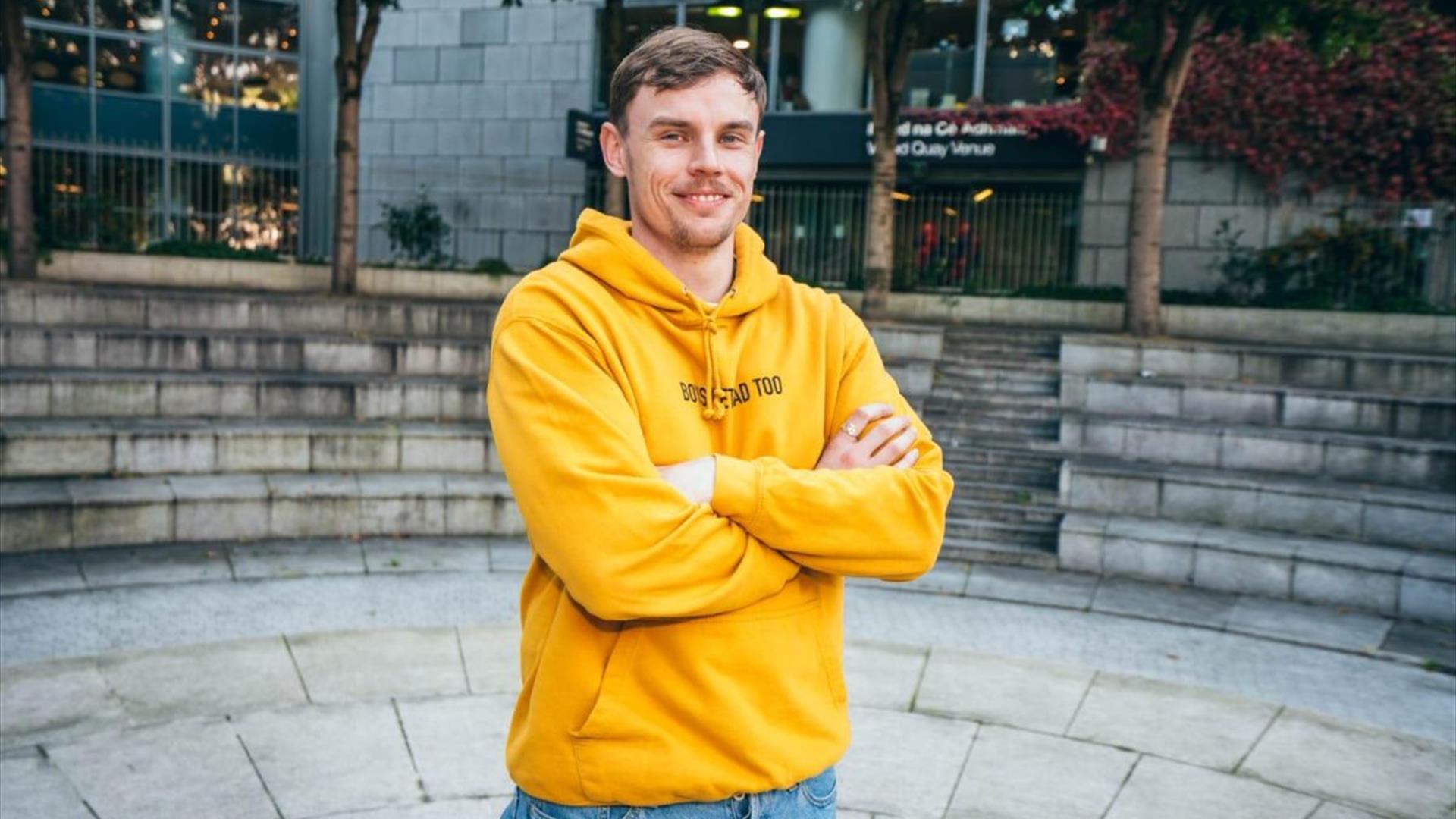 daragh fleming standing with folded arms in a yellow hoodie daragh fleming standing with folded arms in a yellow hoodie
