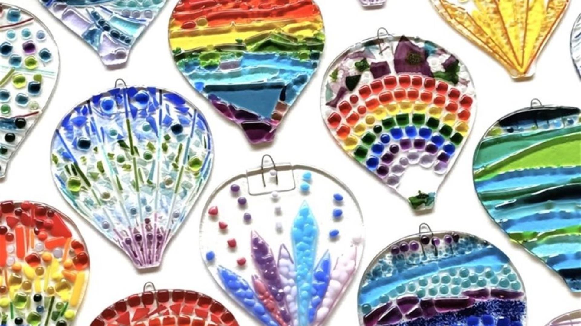 fused glass hot air balloons of a variety of shapes and sizes, with colourful patterns fused glass hot air balloons of a variety of shapes and sizes, with colourful patterns