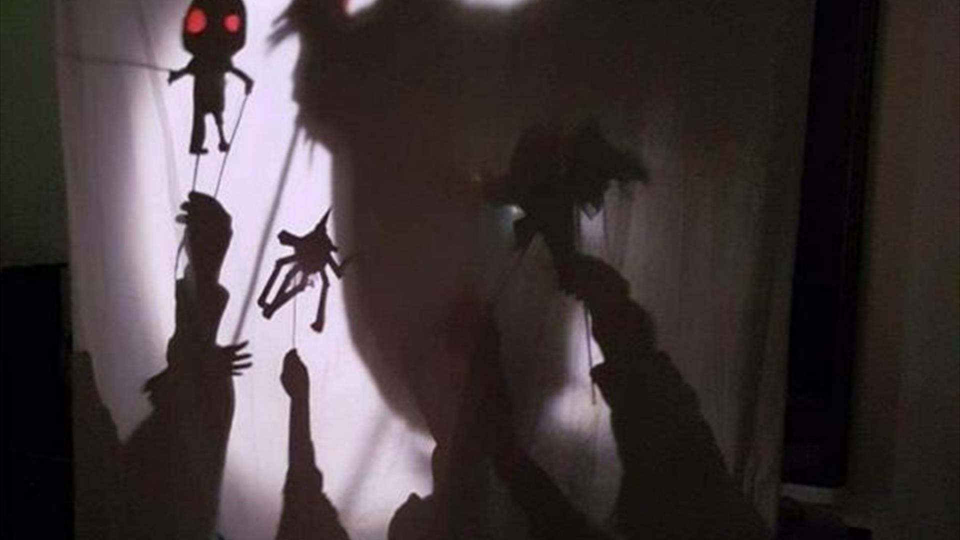 Halloween Shadow Puppets behind a white sheet