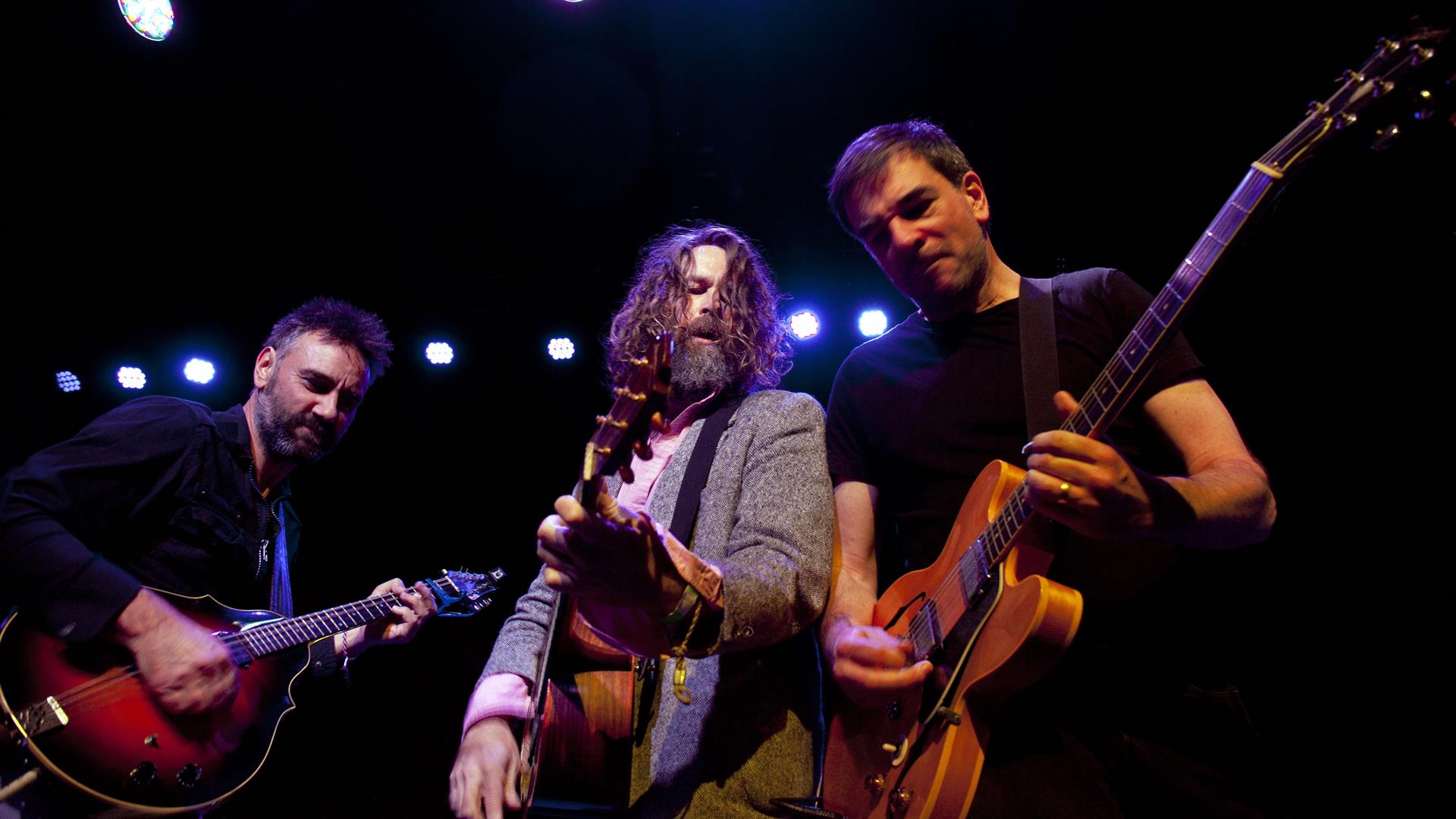 Image of 3 member of hothouse flowers on stage. Image of 3 member of hothouse flowers on stage.