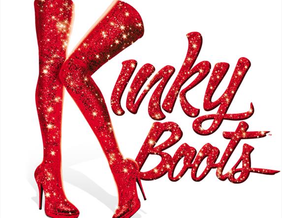 Image shows the words 'Kinky Boots' in red glitter. The letter 'K' is shown as a pair of legs wearing high heel shoes