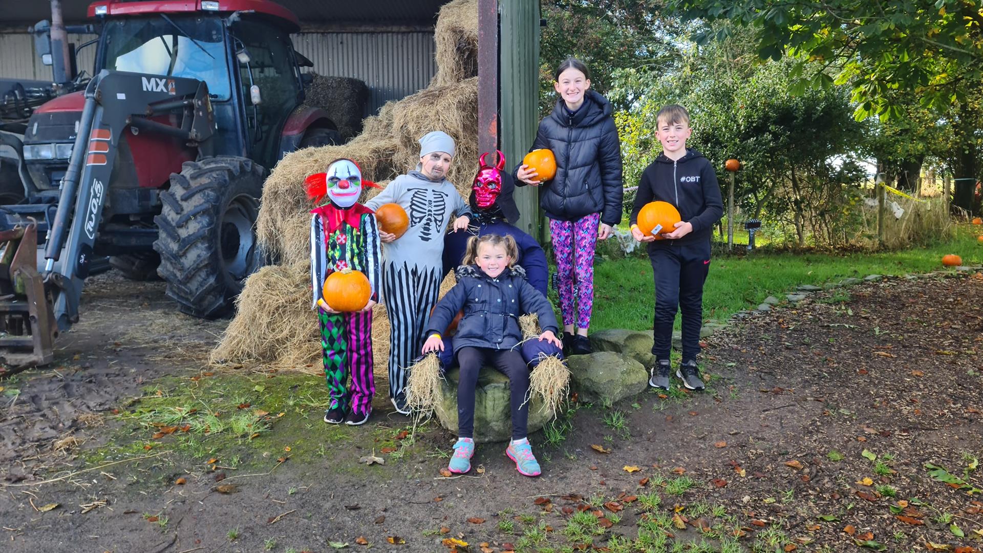 Children in Halloween fancy dress at the pumpkin patch