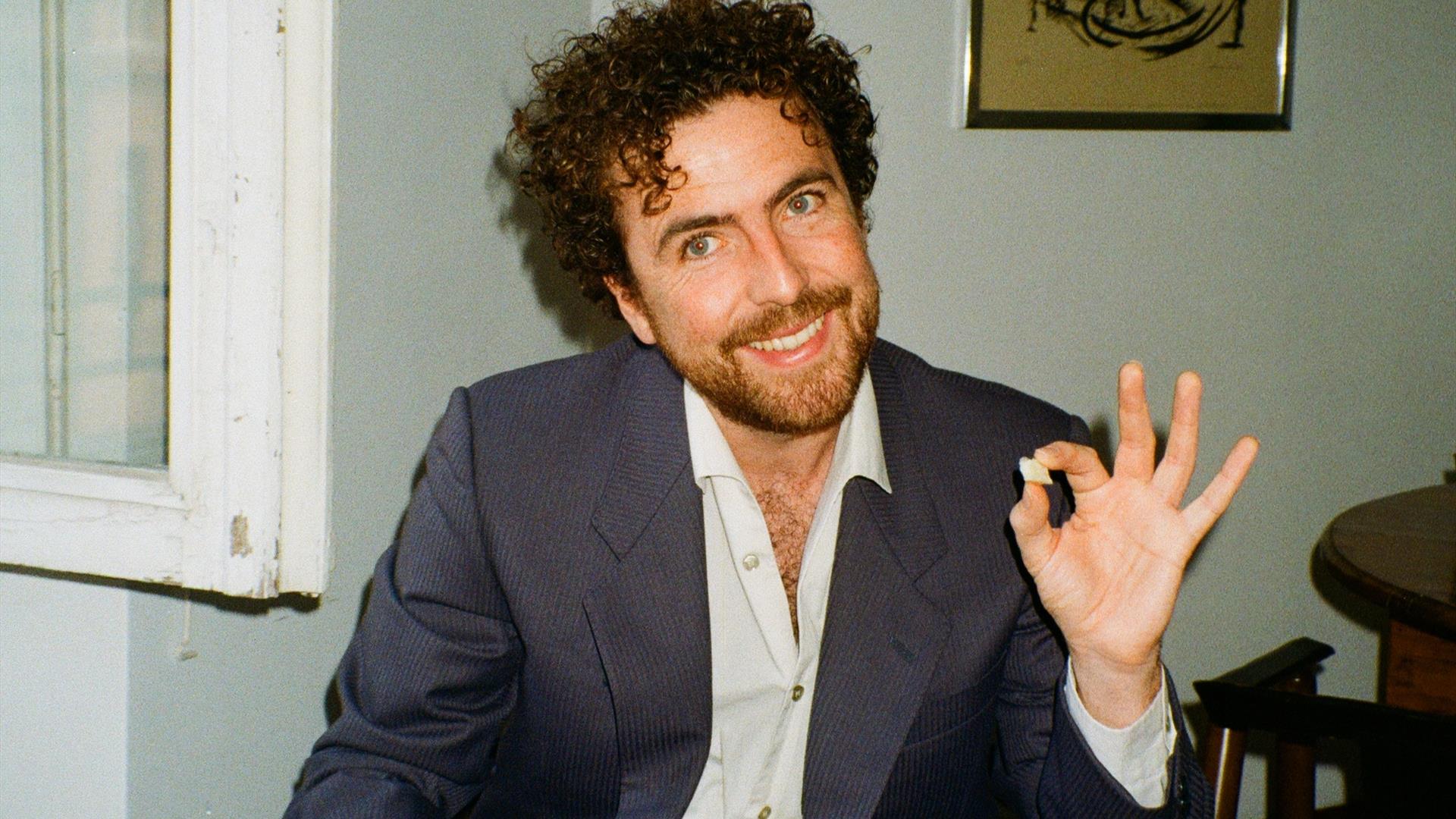 michael mcgovern posing with a drink in one hand michael mcgovern posing with a drink in one hand