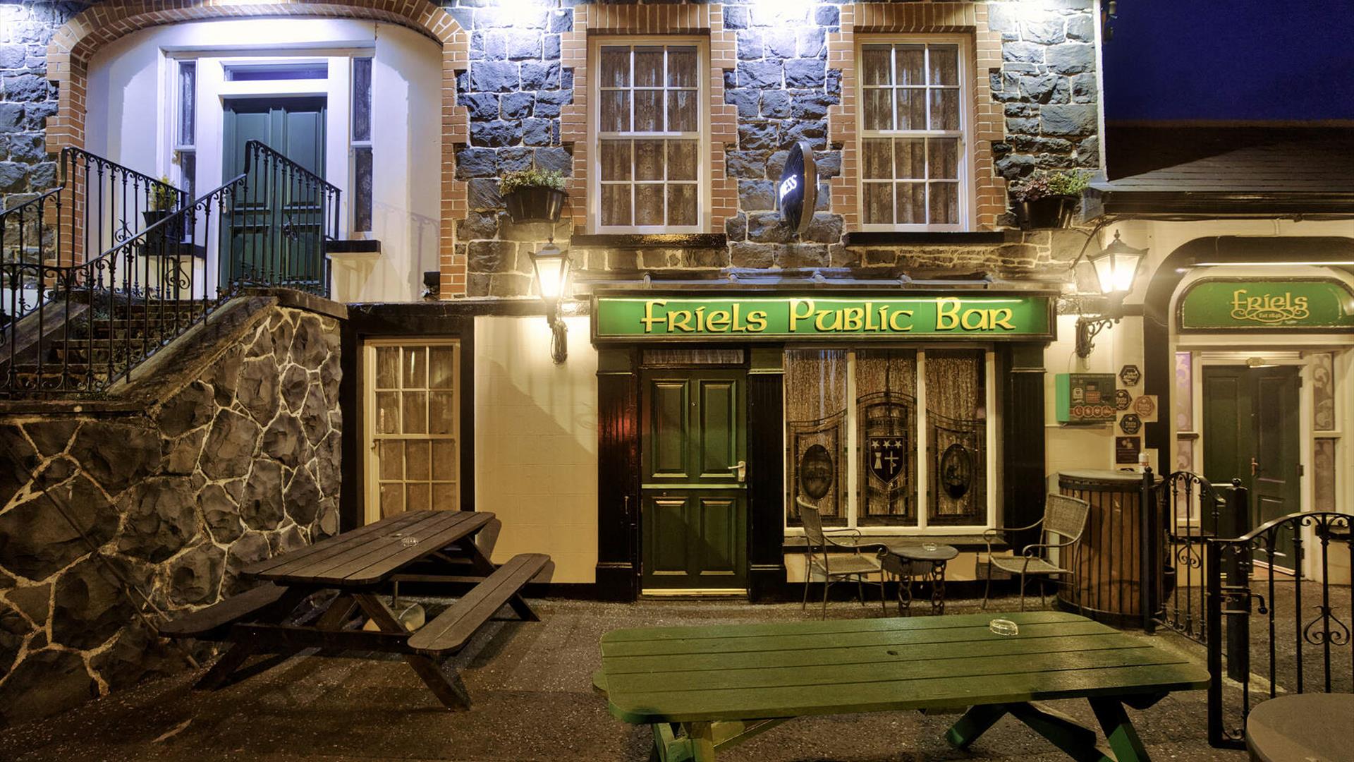 Night-time view of the entrance to Friels Bar Night-time view of the entrance to Friels Bar