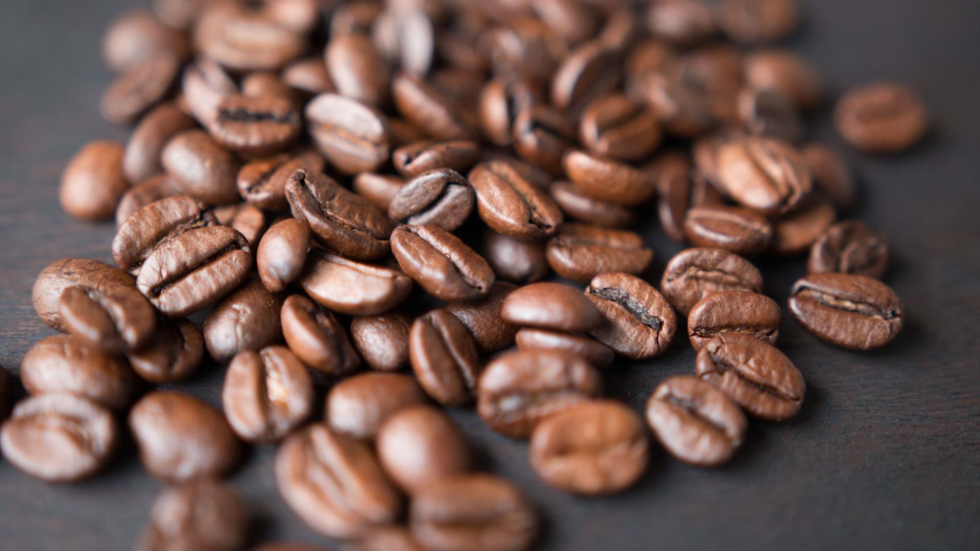 Image shows coffee beans on the table