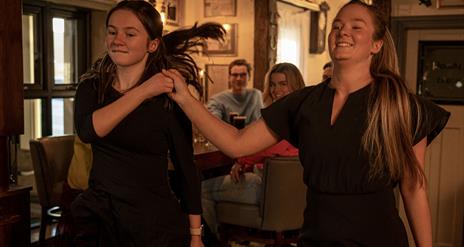 Two dancers doing a demonstration as part of the Ceili & Craic experience at The Ponderosa.