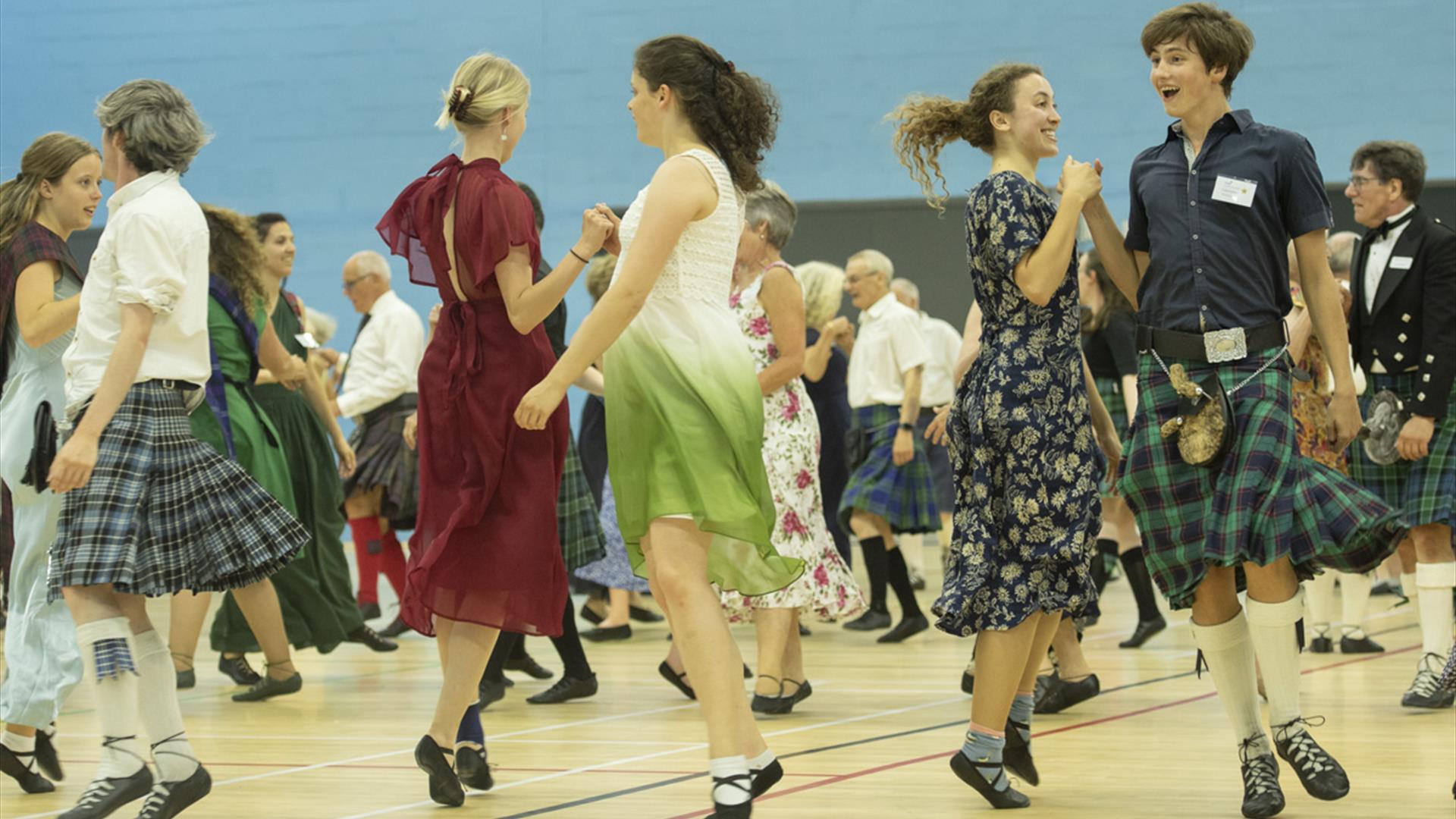 image of a group of peple dancing highland group dance. image of a group of peple dancing highland group dance.