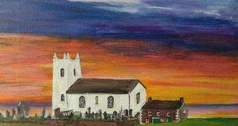 Image shows a painting of Ballintoy Church in white, with green fields and an orange and blue sky