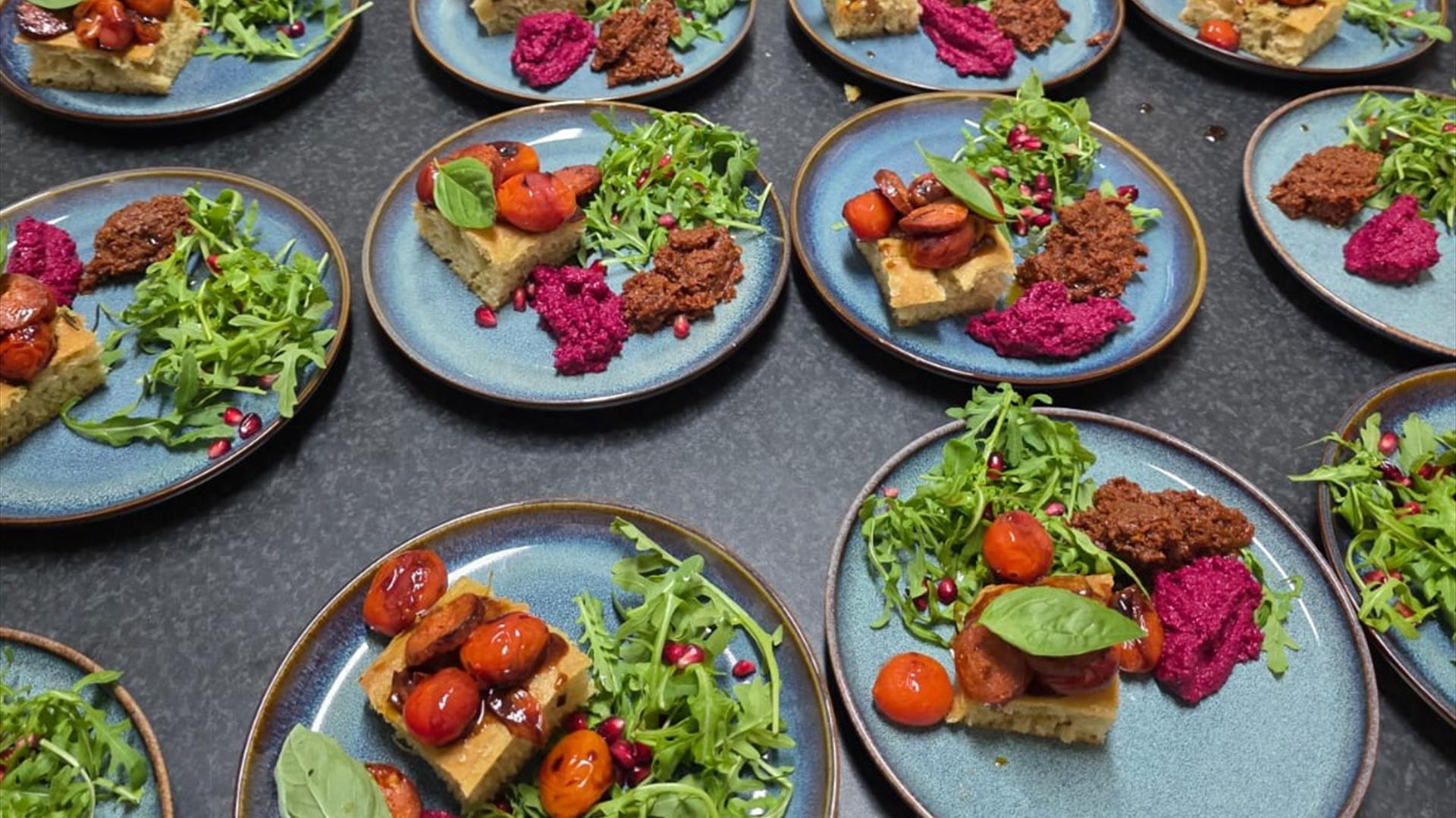 plates of food are laid out on a table plates of food are laid out on a table
