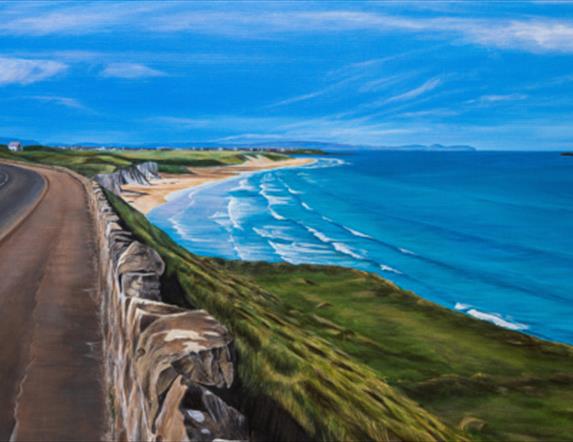 painting of a coastal road looking down on to a beach and the sea on a b right sunny day.