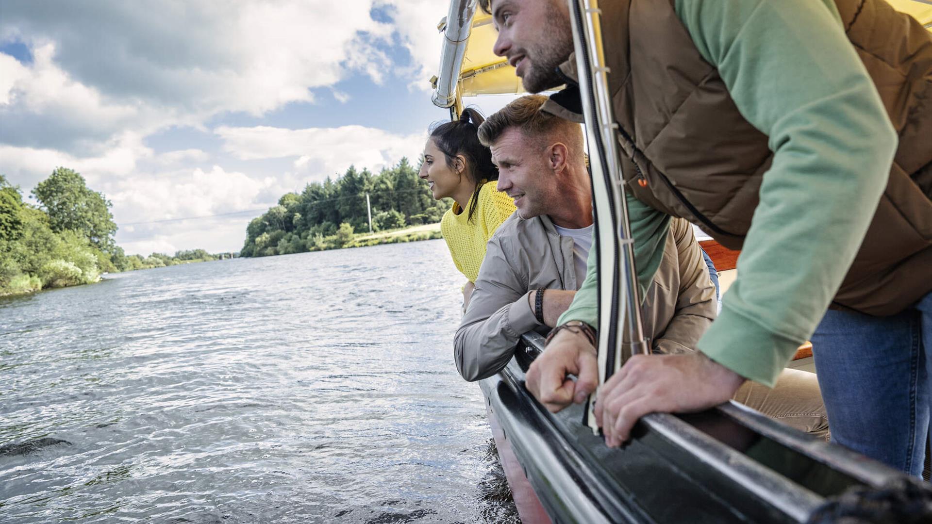 Guests admire the riverbanks from the river's perspective during the Best of the Bann experience