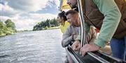 Guests admire the riverbanks from the river's perspective during the Best of the Bann experience Guests admire the riverbanks from the river's perspective during the Best of the Bann experience