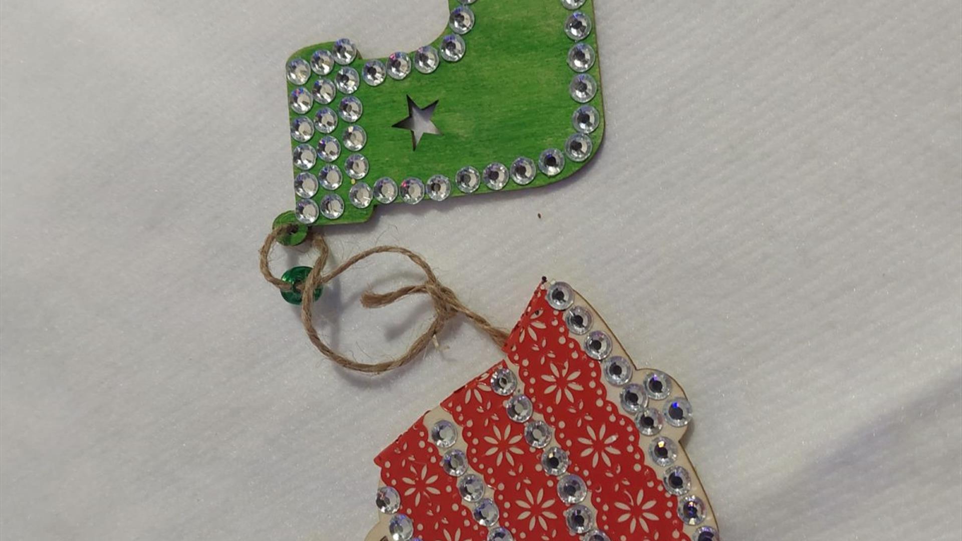 two little wooden christmas decoraitons decorated with paint and sparkly gems two little wooden christmas decoraitons decorated with paint and sparkly gems