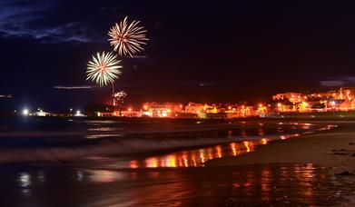 Fireworks light up the sky above Ramore Head