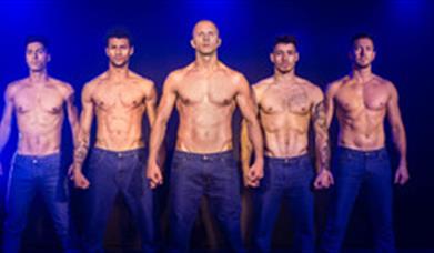 Image of a group of men performing on stage