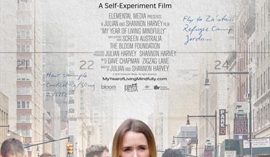 Movie poster for 'My Year of Living Mindfully - a lady in a green dress with people in the background looking down at their mobile phones