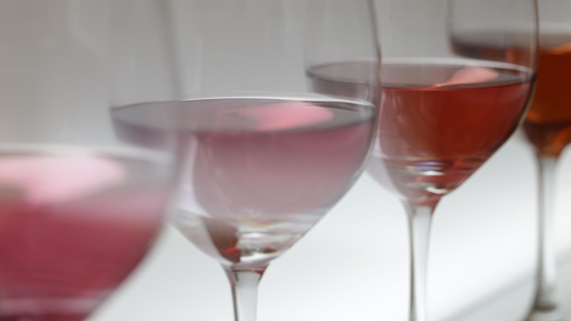 four glasses of rosé wine four glasses of rosé wine