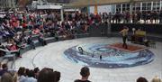 A crowd watches the entertainment in the Amphitheatre in Portrush