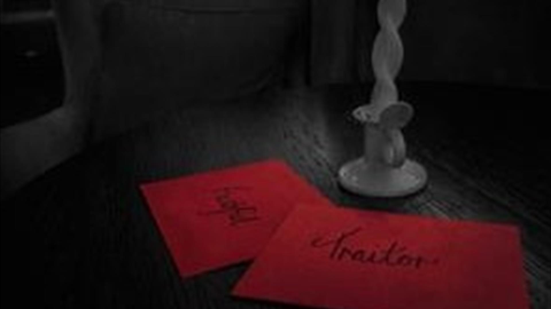 two red envelopes on a table, one reads "faithful" and the other "traitor" two red envelopes on a table, one reads "faithful" and the other "traitor"